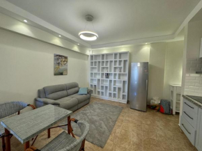 A one-bedroom apartment with a compact terrace
